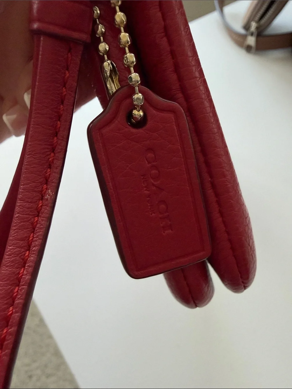 Coach compact pebbled